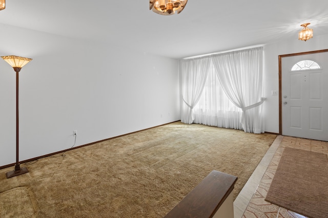 15895 Bexley St, Clinton Township, MI 48038 - foyer entrance with carpet floors, a chandelier, and baseboards