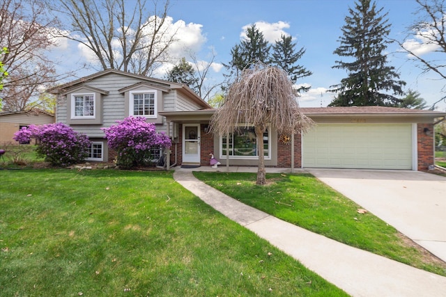 split level home with concrete driveway, brick siding, an attached garage, and a front lawn