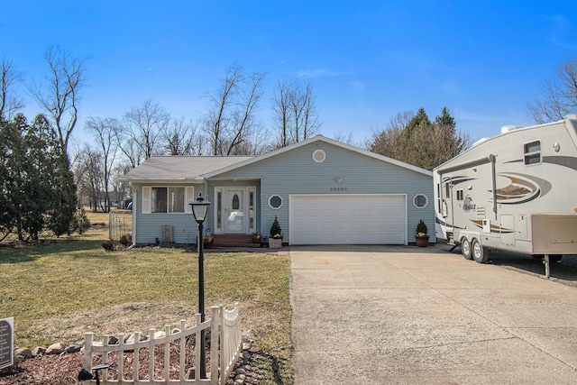 ranch-style home featuring driveway, a front yard, and an attached garage
