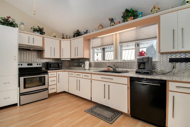 kitchen featuring a sink, stainless steel appliances, under cabinet range hood, tasteful backsplash, and light wood-style flooring