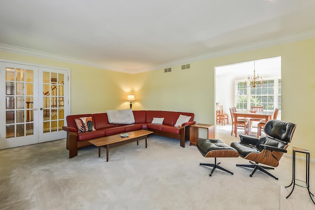 living room featuring crown molding, carpet flooring, a chandelier, and french doors