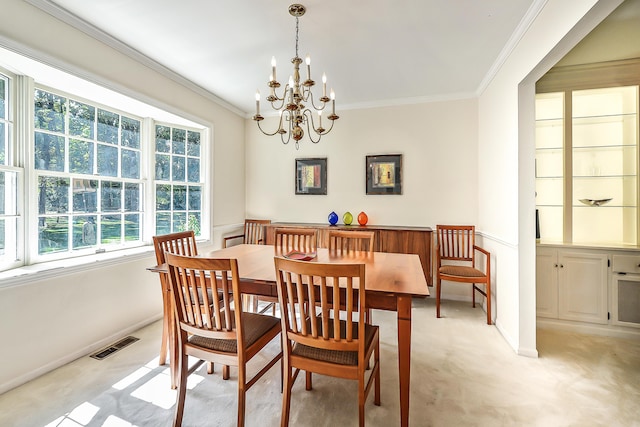 dining area with ornamental molding, visible vents, a chandelier, and baseboards