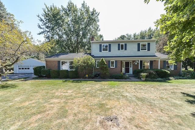 traditional-style house with a chimney, covered porch, brick siding, a detached garage, and a front lawn
