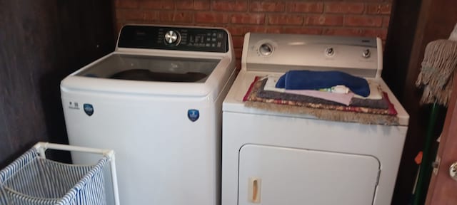 laundry area featuring separate washer and dryer and laundry area