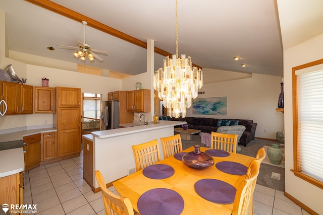 7077 Crosswinds Dr, Swartz Creek, MI 48473 - dining space with light tile patterned flooring, baseboards, vaulted ceiling with beams, and ceiling fan with notable chandelier