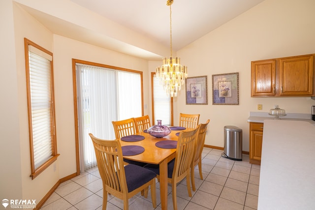 7077 Crosswinds Dr, Swartz Creek, MI 48473 - dining room with light tile patterned floors, baseboards, lofted ceiling, and plenty of natural light