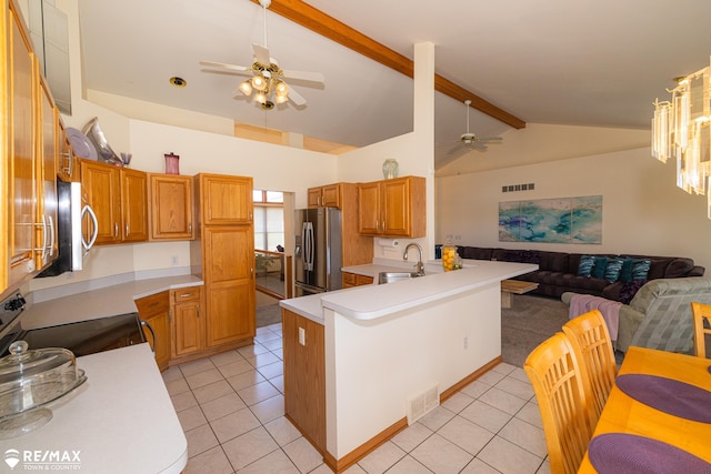 7077 Crosswinds Dr, Swartz Creek, MI 48473 - kitchen with appliances with stainless steel finishes, open floor plan, ceiling fan, and visible vents