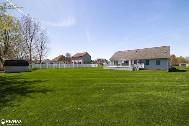 7077 Crosswinds Dr, Swartz Creek, MI 48473 - view of yard featuring an outbuilding, a storage shed, and fence