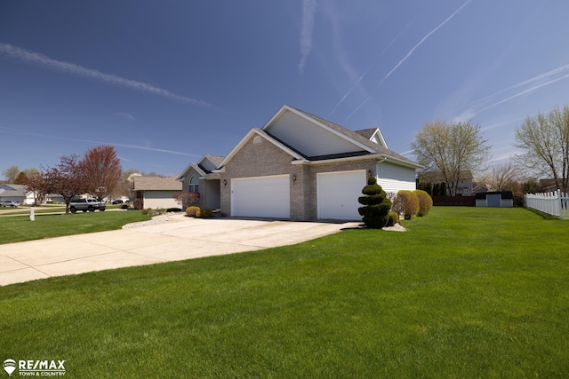 7077 Crosswinds Dr, Swartz Creek, MI 48473 - view of front of house with a front lawn, driveway, a garage, and brick siding