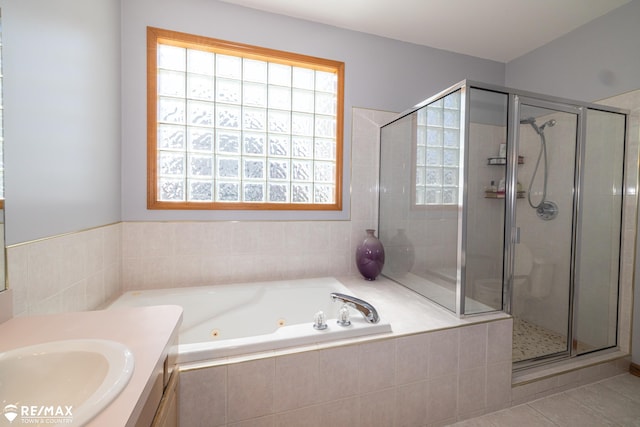 7077 Crosswinds Dr, Swartz Creek, MI 48473 - bathroom with tile patterned floors, a jetted tub, a shower stall, and vanity