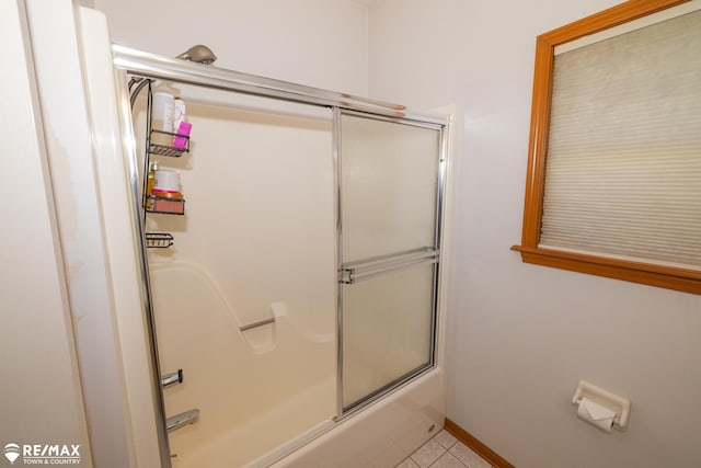 7077 Crosswinds Dr, Swartz Creek, MI 48473 - bathroom with combined bath / shower with glass door and tile patterned floors