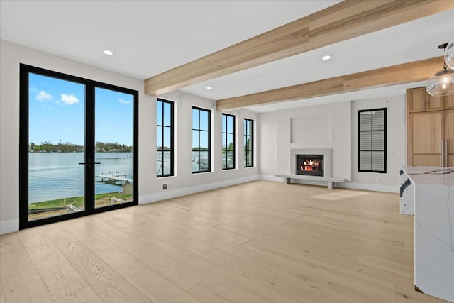 13459 Haddon St, Fenton, MI 48430 - unfurnished living room featuring baseboards, beamed ceiling, and a water view