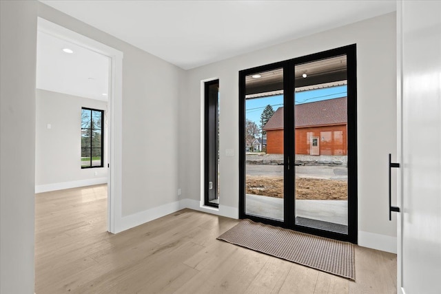 13459 Haddon St, Fenton, MI 48430 - doorway to outside with baseboards and wood finished floors