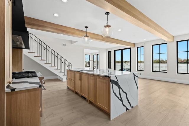 13459 Haddon St, Fenton, MI 48430 - kitchen with recessed lighting, beamed ceiling, light stone countertops, and a sink