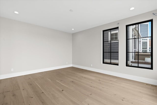 13459 Haddon St, Fenton, MI 48430 - unfurnished room with light wood-style floors, recessed lighting, and baseboards