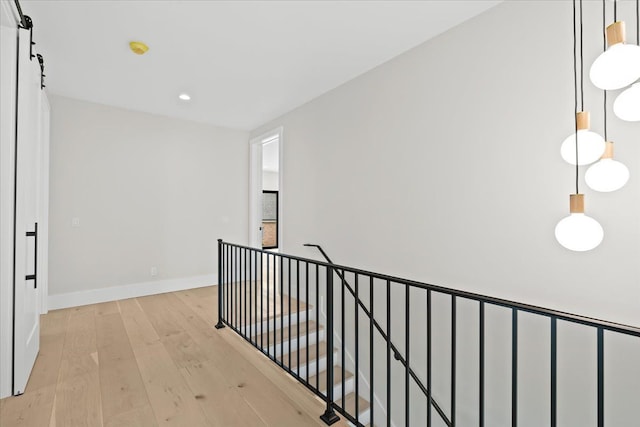 13459 Haddon St, Fenton, MI 48430 - corridor with light wood-style floors, baseboards, recessed lighting, and an upstairs landing