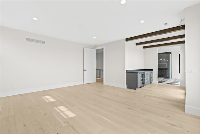 13459 Haddon St, Fenton, MI 48430 - empty room with baseboards, visible vents, and light wood-type flooring