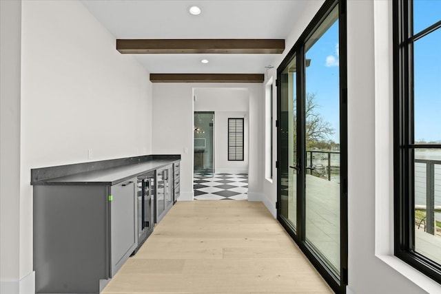 13459 Haddon St, Fenton, MI 48430 - hall featuring recessed lighting, beamed ceiling, a wealth of natural light, and light wood-style flooring