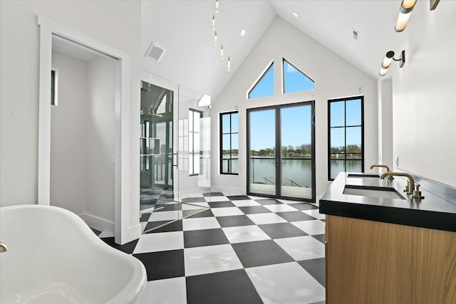 13459 Haddon St, Fenton, MI 48430 - interior space featuring a sink, tile patterned floors, a water view, and visible vents