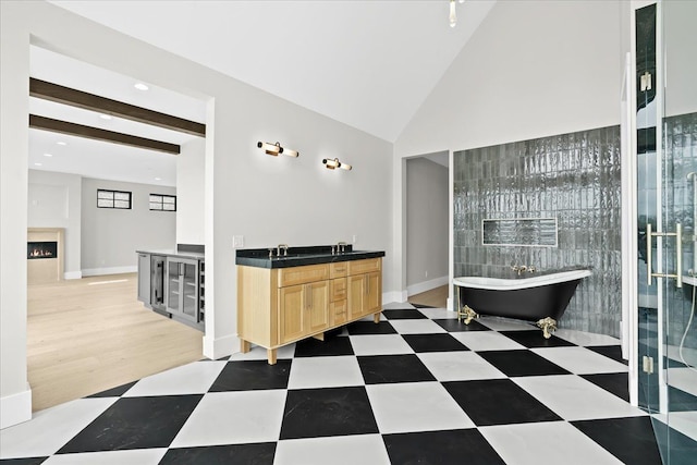 13459 Haddon St, Fenton, MI 48430 - full bath featuring a freestanding bath, vanity, tile patterned floors, recessed lighting, and baseboards