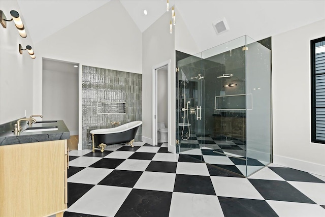 13459 Haddon St, Fenton, MI 48430 - bathroom with visible vents, a stall shower, a sink, toilet, and a soaking tub