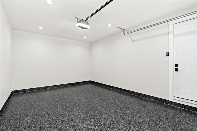 13459 Haddon St, Fenton, MI 48430 - garage with recessed lighting, baseboards, and a garage door opener