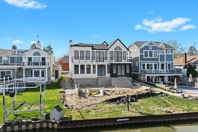 13459 Haddon St, Fenton, MI 48430 - rear view of house with a water view, a balcony, and a residential view