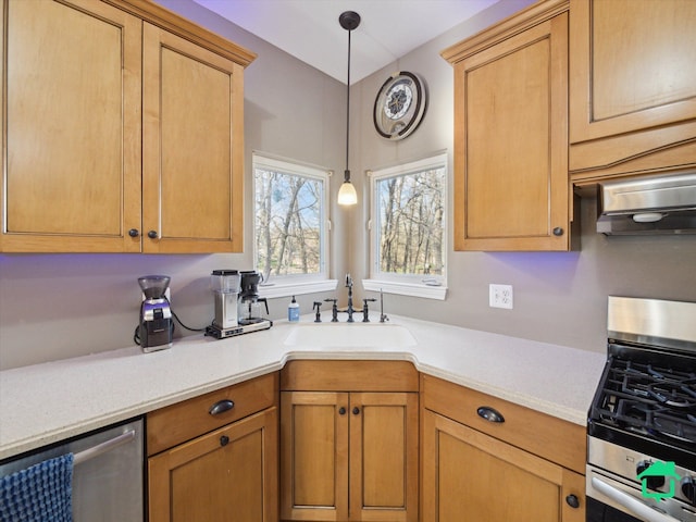 kitchen featuring pendant lighting, a sink, stainless steel appliances, light countertops, and exhaust hood