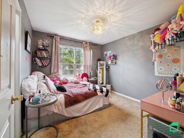bedroom with baseboards and carpet