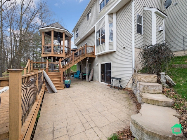 back of property with a patio, stairway, a wooden deck, and cooling unit