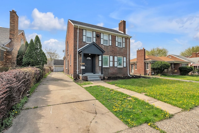 8790 E Outer Dr, Detroit, MI 48213 - view of front of home with fence, a chimney, brick siding, and a front lawn