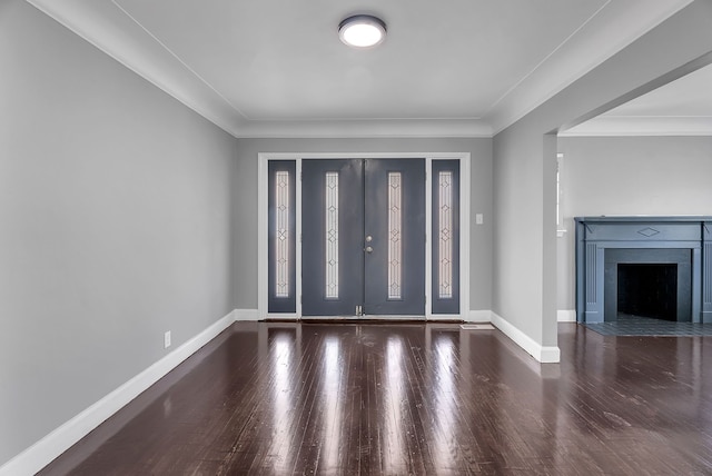 8790 E Outer Dr, Detroit, MI 48213 - entryway with a fireplace with flush hearth, wood finished floors, ornamental molding, and baseboards