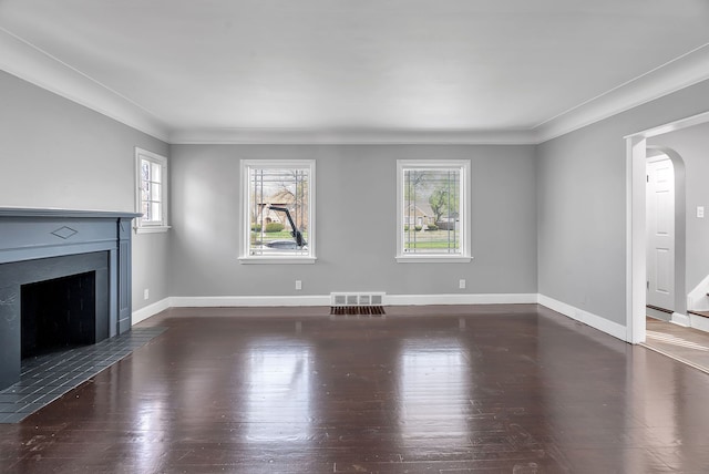 8790 E Outer Dr, Detroit, MI 48213 - unfurnished living room with wood finished floors, baseboards, visible vents, a fireplace with flush hearth, and crown molding
