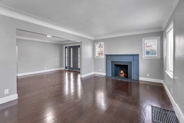 8790 E Outer Dr, Detroit, MI 48213 - unfurnished living room with wood finished floors, ornamental molding, baseboards, visible vents, and a fireplace with flush hearth