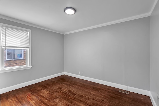 8790 E Outer Dr, Detroit, MI 48213 - spare room featuring visible vents, ornamental molding, dark wood-style floors, and baseboards