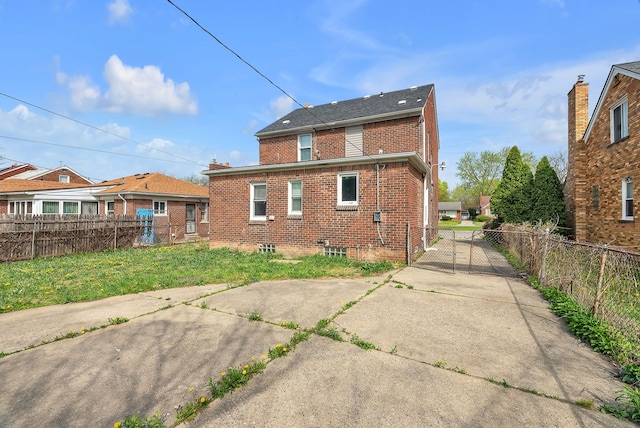 8790 E Outer Dr, Detroit, MI 48213 - back of property with brick siding and fence