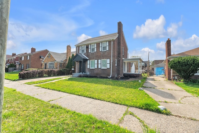 8790 E Outer Dr, Detroit, MI 48213 - view of front of property with a front lawn, concrete driveway, brick siding, and a residential view