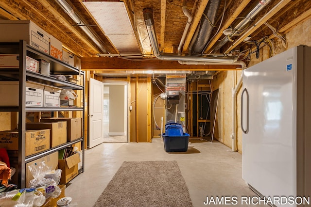 unfinished below grade area with freestanding refrigerator