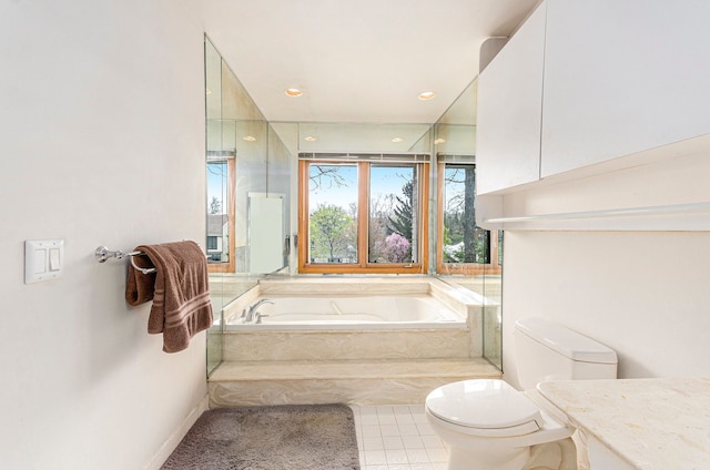 bathroom with a bath, tile patterned flooring, vanity, toilet, and recessed lighting