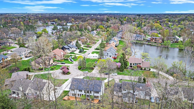 birds eye view of property with a water view and a residential view
