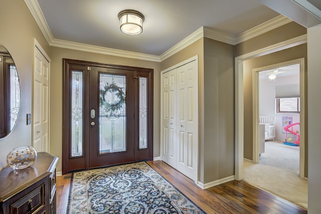 entrance foyer with a healthy amount of sunlight, crown molding, and wood finished floors