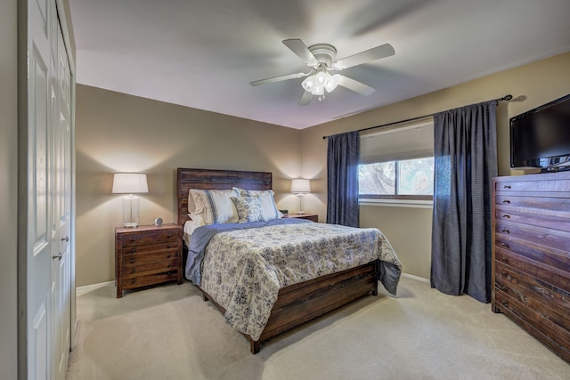 bedroom with baseboards, ceiling fan, and carpet flooring