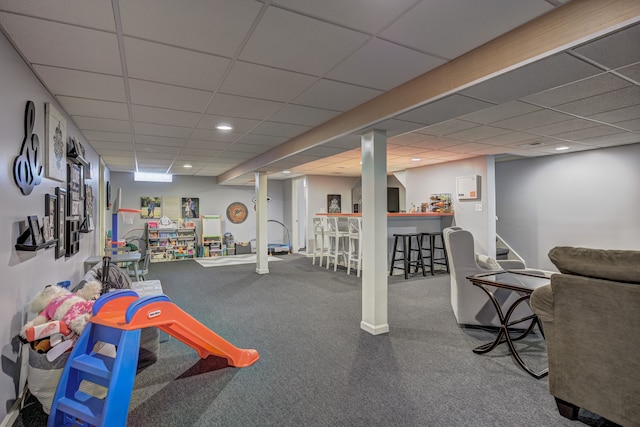 recreation room featuring carpet floors, recessed lighting, and a paneled ceiling