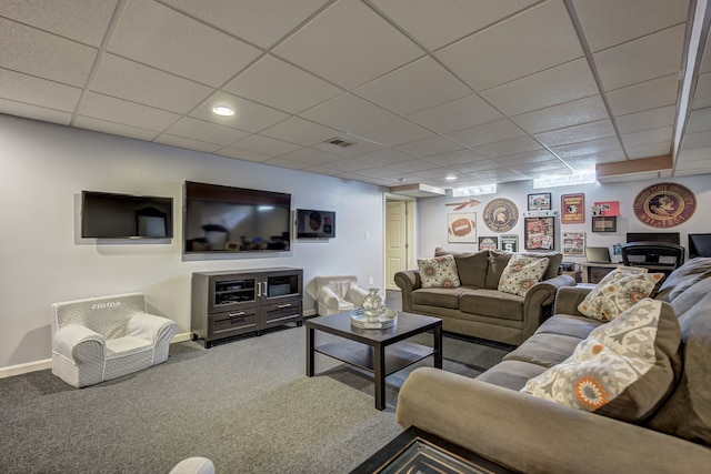 living room featuring carpet floors, baseboards, visible vents, and a paneled ceiling