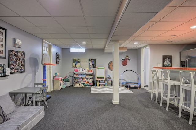 recreation room with carpet floors, recessed lighting, and a paneled ceiling