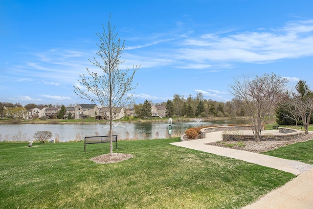 view of yard with a water view and a residential view