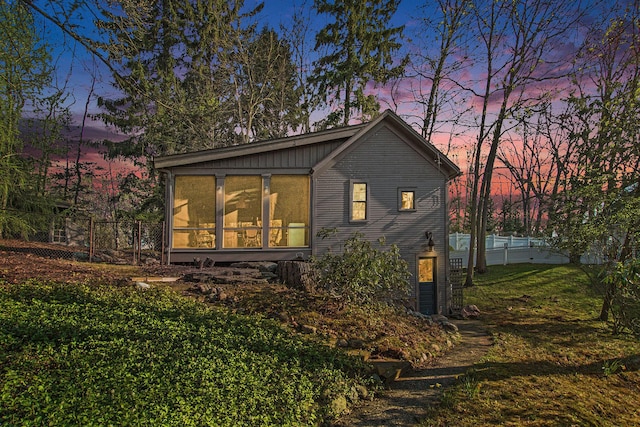 350 Ferry St, Douglas, MI 49406 - exterior space featuring a sunroom, a yard, and fence