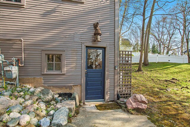 350 Ferry St, Douglas, MI 49406 - property entrance featuring a lawn and fence