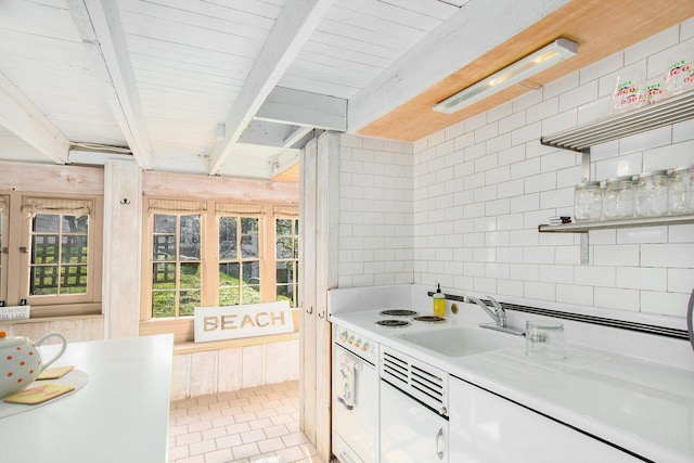 350 Ferry St, Douglas, MI 49406 - kitchen featuring beamed ceiling, a sink, decorative backsplash, open shelves, and light countertops