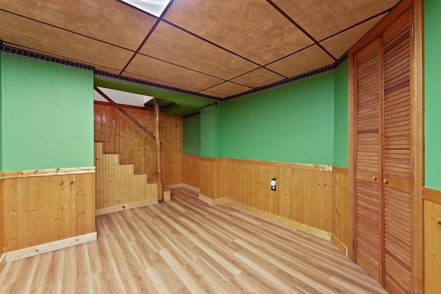 320 Marble St, Cadillac, MI 49601 - finished basement with a wainscoted wall, wood walls, and wood finished floors